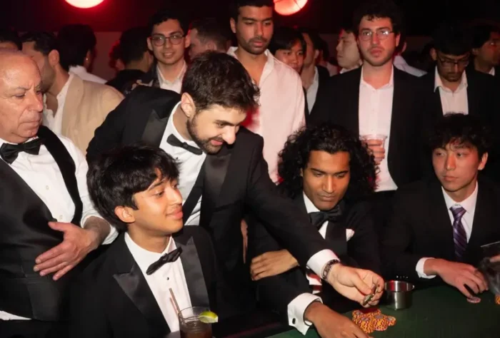 Formal Dressed Men playing a Charity Poker Tournament.
