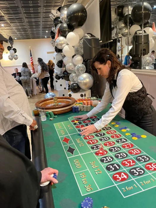 Roulette Dealer Performing here duties at the table