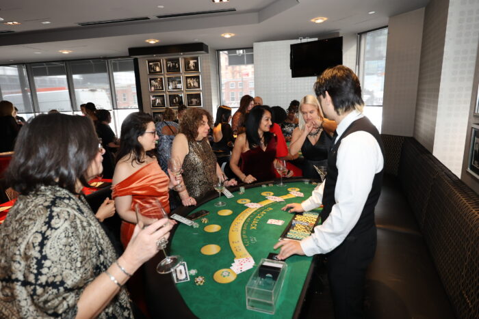 Guests playing Blackjack at a corporate casino party on Long Island